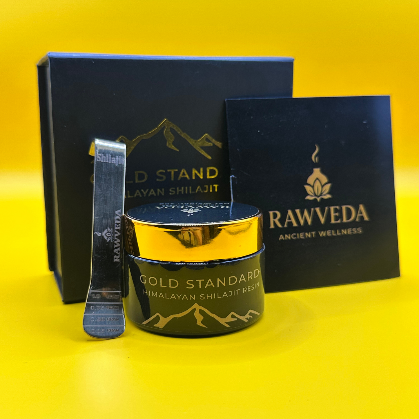 Rawveda Gold Standard Himalayan Shilajit Resin packaging on a yellow background